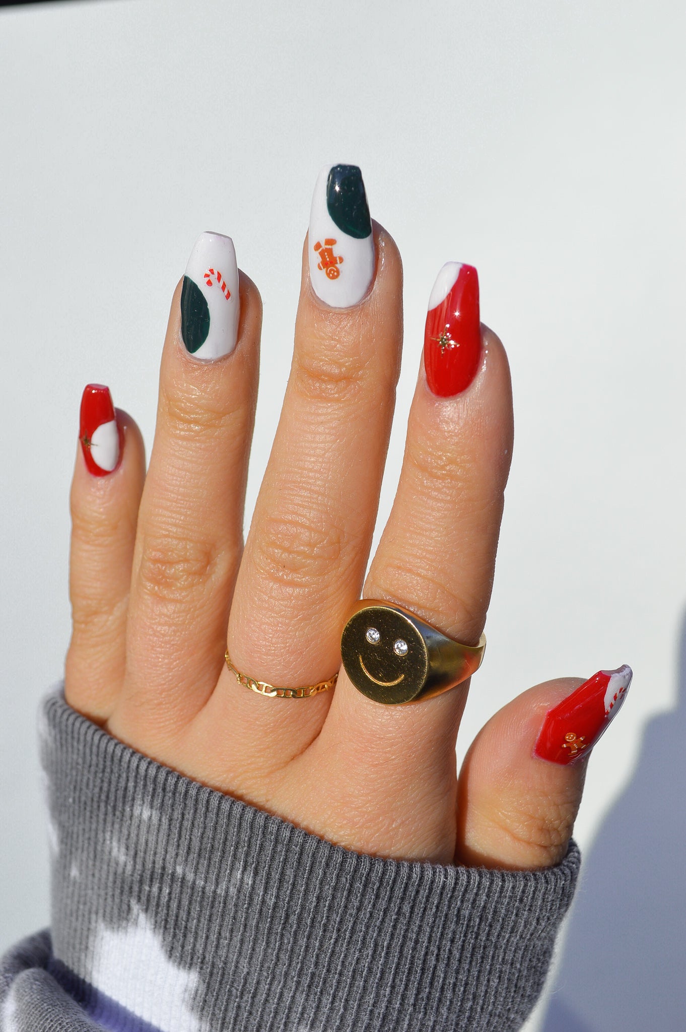 Holiday nail art sticker look with gingerbreads